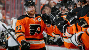 Ice Hockey Player Jakub Voracek Fist Bump With Teammates Wallpaper