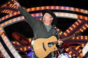 Iconic Garth Brooks In A Stylish Gray Suit Wallpaper