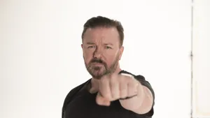 Iconic Stand-up Comedian Ricky Gervais In An Intimate Moment Wallpaper