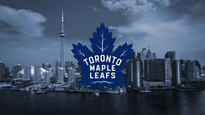 Iconic Toronto Maple Leafs Logo With Lakeside Buildings As Backdrop Wallpaper