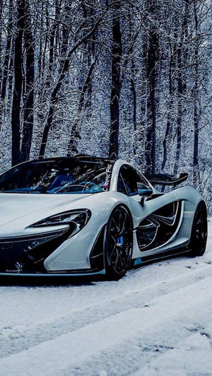 Icy Elegance: Mclaren P1 In A Snowy Landscape Viewed From An Iphone Wallpaper