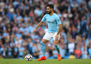 Ilkay Gundogan Kicking Ball To Side Wallpaper