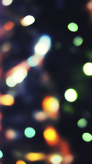 Illuminate The Holidays With This Festive Christmas Lights Iphone Wallpaper Wallpaper