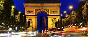 Illuminated Arch In Paris Wallpaper