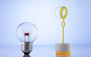 Illuminated Light Bulb Floating In A Bubble Wallpaper