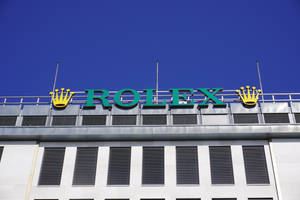 Impressive Rolex Logo On Building Facade Wallpaper