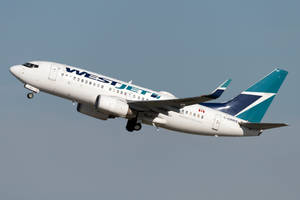 In Flight Westjet Airplane Wallpaper