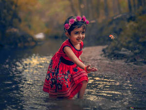 Indian Girl Child In The River Wallpaper