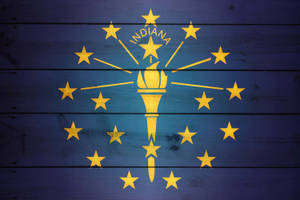 Indiana's State Torch On A Rustic Wooden Background Wallpaper