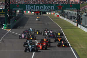 Intense Competition At The Formula 1 Grand Prix Wallpaper