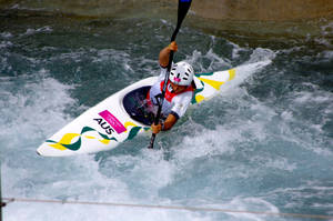 Intense Slalom K-1 Canoeing Competition In Action Wallpaper