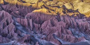 Ipad Pro Rocky Mountain Range Under Sun Wallpaper