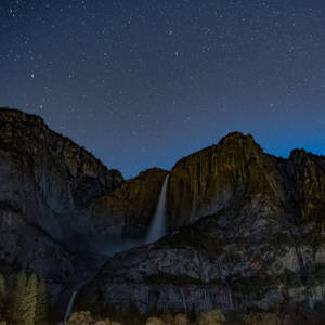 Ipad Pro Waterfall On Mountain At Night Wallpaper
