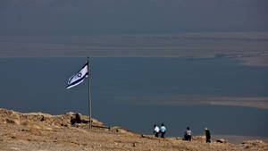 Israel Flag Fluttering By The Seaside Wallpaper
