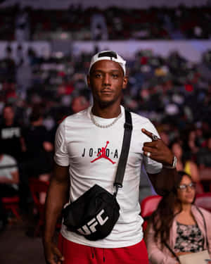 Jamahal Hill Against Blurry Crowd Wallpaper