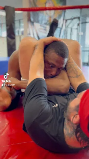 Jamahal Hill Trapped In Triangle Choke Wallpaper
