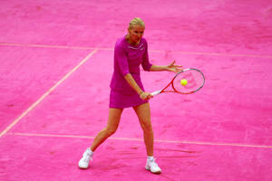 Jana Novotna Playing Tennis On A Pink Court Wallpaper