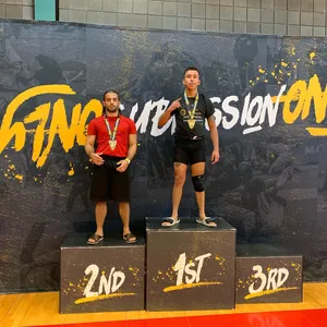 Jeff Molina Triumphantly Standing On The First-place Podium Wallpaper