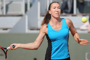 Jelena Jankovic Executes A Forehand Stroke During A Tennis Match Wallpaper