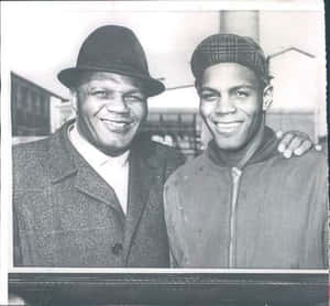 Jersey Joe Walcott And His Grandson Wallpaper