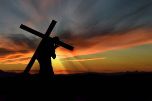 Jesus Cross Carried During Sunset Wallpaper