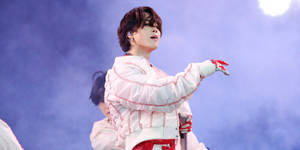 Jimin Of Bts Performing On Stage Wallpaper