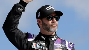 Jimmie Johnson Celebrating His Victory On The Racetrack Wallpaper