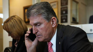 Joe Manchin Answering A Call Wallpaper