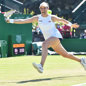 Johanna Konta Chasing Tennis Ball In High Intensity Match Wallpaper