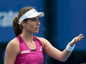 Johanna Konta In Dynamic Tennis Action Wallpaper