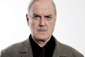 John Cleese In A Classic Comedic Pose. Wallpaper