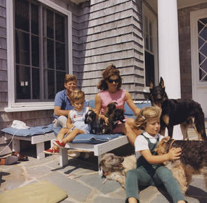 John F. Kennedy With His Family In An Intimate Home Scene Wallpaper