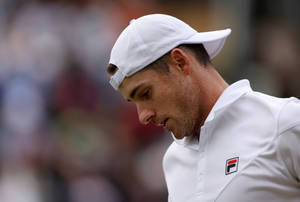 John Isner In White Tennis Cap Wallpaper