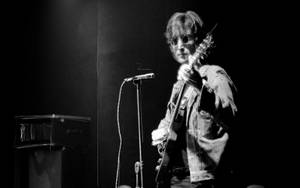 John Lennon Playing Electric Guitar Wallpaper