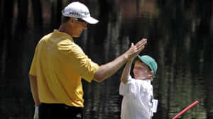 John Senden High-five With Son Wallpaper