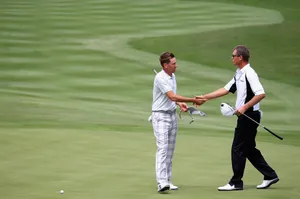 John Senden Shaking Hands On Course Wallpaper