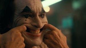 Joker 2020 Pulling His Mouth Wallpaper