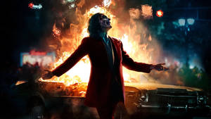 Joker With Car On Fire Wallpaper