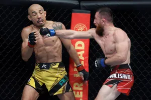 José Aldo Takes Punch From Mcgregor Wallpaper