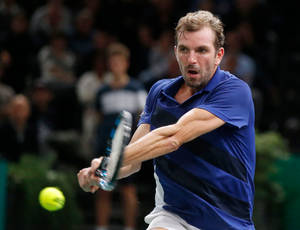 Julien Benneteau Framed In Perfect Two-handed Backhand Stroke Wallpaper