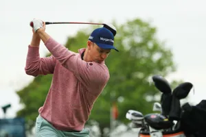Justin Rose Swinging For A Golf Shot Wallpaper