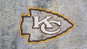 Kansas City Chiefs Logo On Concrete Wallpaper