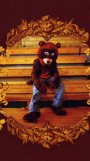 Kanye West Bear Mascot Costume On Bleachers Wallpaper