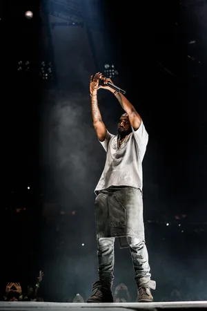 Kanye West Poses With His Album