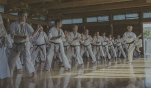 Karate Students Posing At Dojo Wallpaper