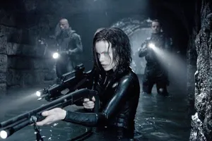 Kate Beckinsale In Her Signature Blue Underworld Costume Wallpaper
