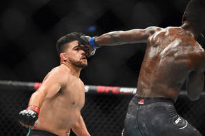 Kelvin Gastelum Getting Hit In The Face Wallpaper