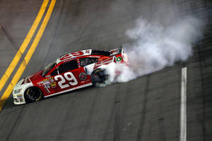 Kevin Harvick Burning Rubber On Race Track Wallpaper