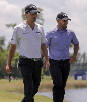 Kevin Kisner And Scott Brown Engaged In Professional Golf Wallpaper