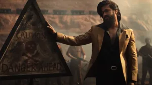 Kgf Chapter 2 Rocky With Caution Sign Wallpaper